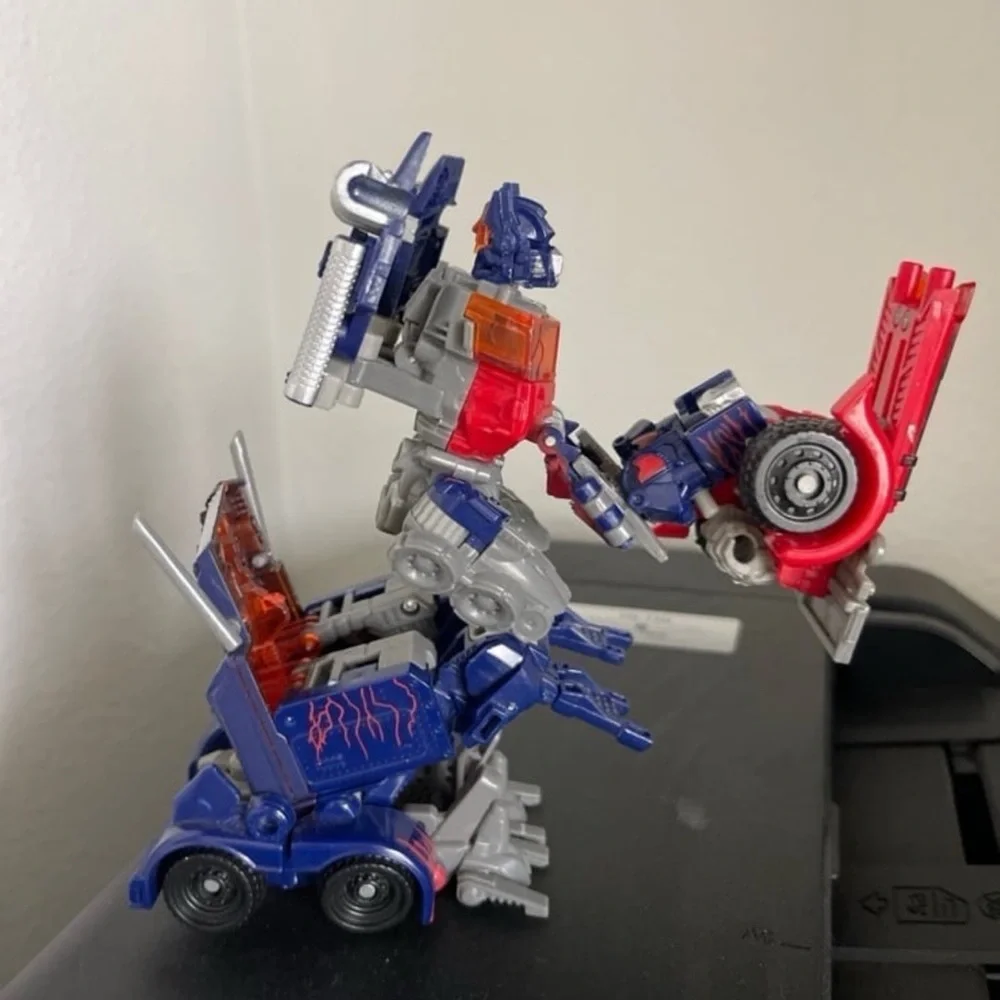 Hasbro Transforming Robot - Red, Blue, and Silver